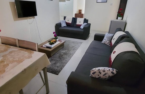 Winneba House | 25 minutes to Winneba Beach! A quiet family suite with dining and living area.