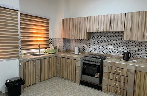 Accra House | GHL G Floor 2 bedrooms Sleep 4. DSTV, WiFi and Solar for work or leisure.