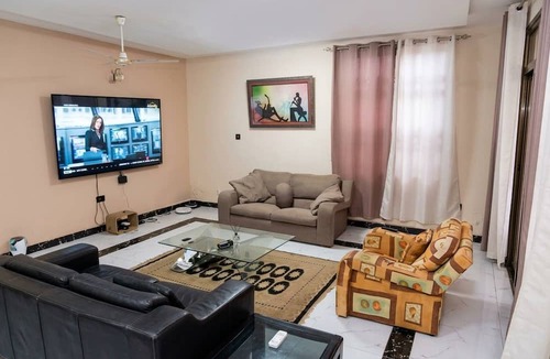 Tema House | A Downtown Gbetsile Studio Balcony + King Bed