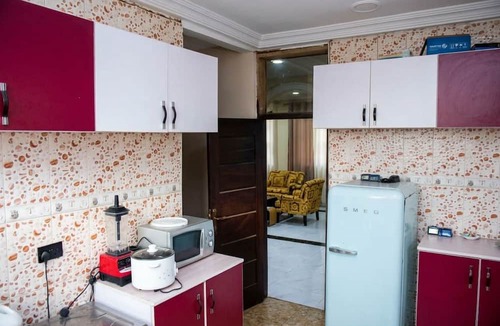 Tema House | A Downtown Gbetsile Studio Balcony + King Bed